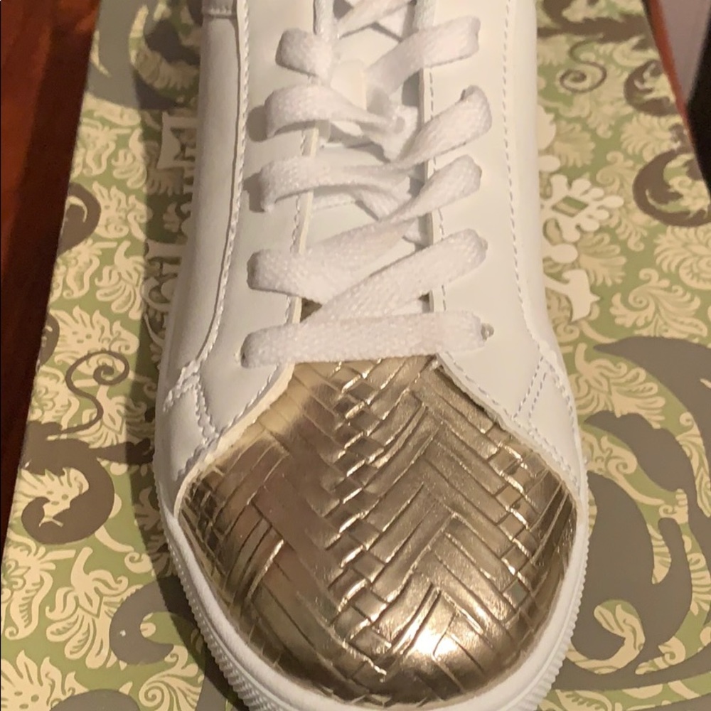 White and gold sneakers